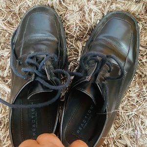 Black Kenneth Cole shoe for kids with lace.